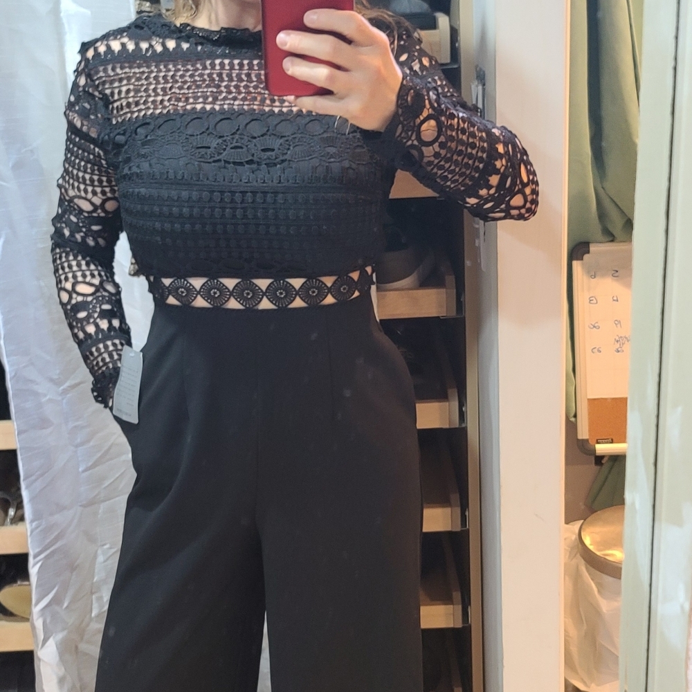 Nwt black jumpsuit with cutouts and pockets
